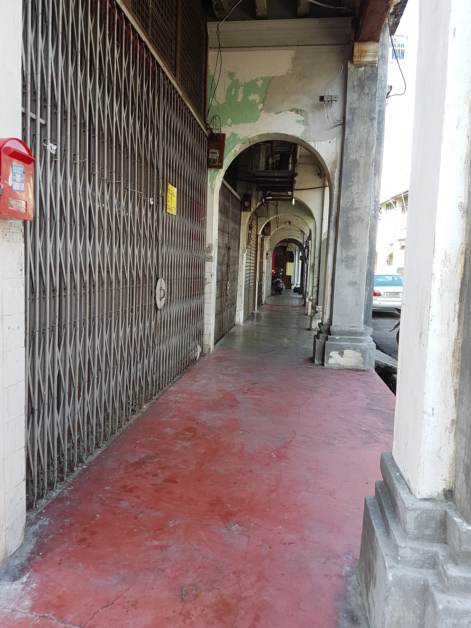 A deep arched five-foot way in George Town, Penang