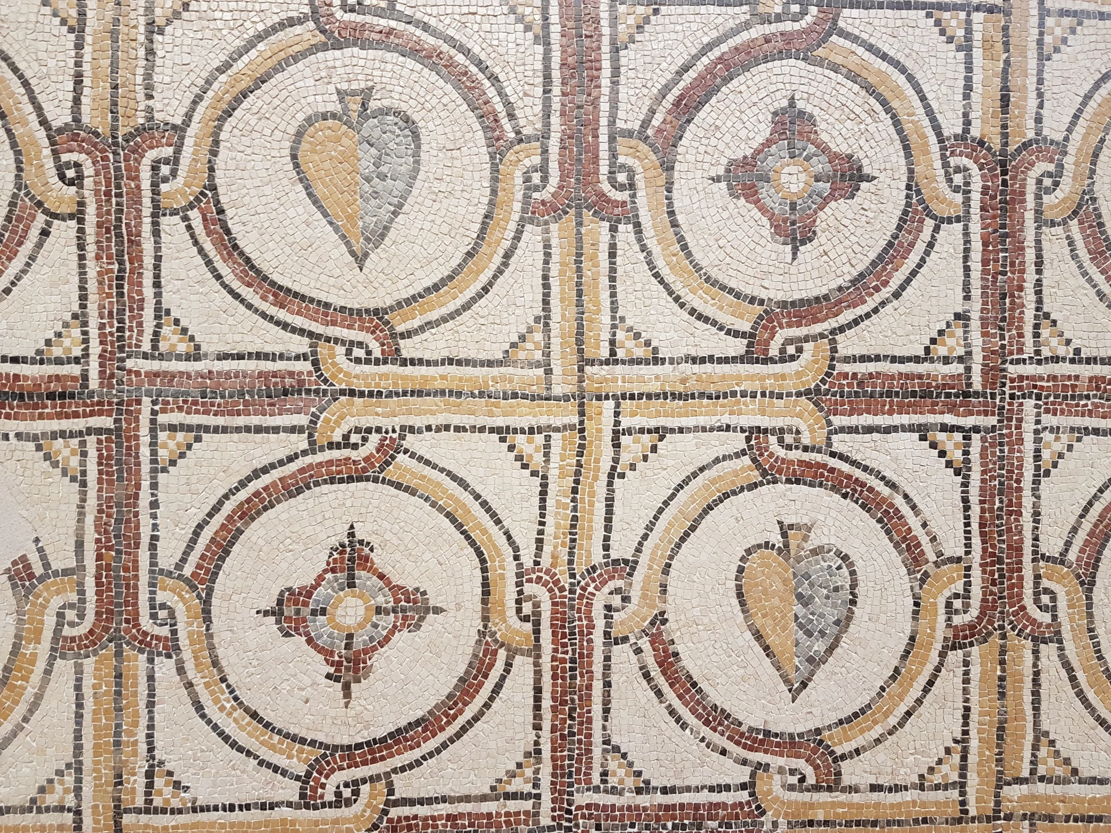 Detailed geometric stone mosaic photographed in Jordan